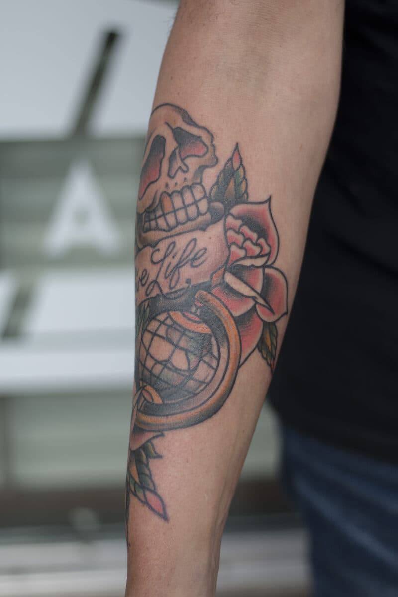 Skull, globe & rose — forearm